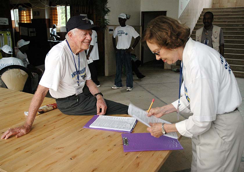 Election observers Rosalynn and Jimmy Carter prepare for poll closing procedures during elections in Monrovia, Liberia, 2005. 
