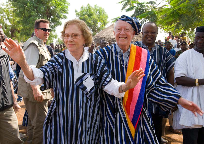 Photo of Jimmy and Rosalynn Carter wearing traditional Ghanaian attire during a visit to Ghana in 2007.