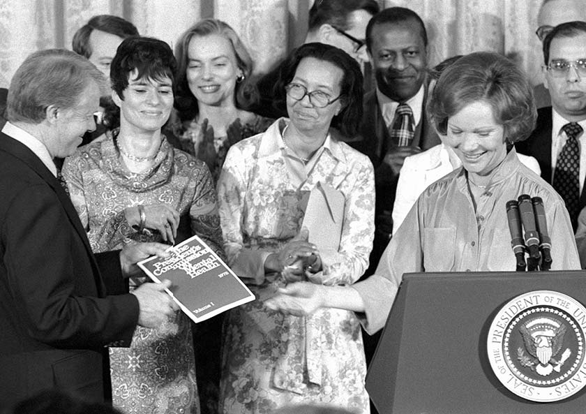 Rosalynn Carter presents President Carter with the commission’s recommendations for reforms to mental health policy and programs, 1978