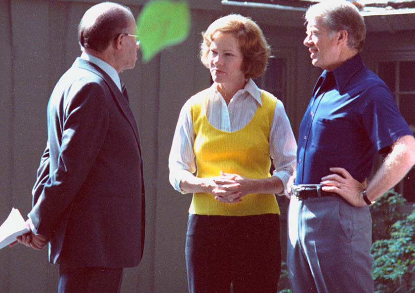 Rosalynn Carter talks with Menachem Begin and President Carter during negotiations between Egypt and Israel at Camp David. 