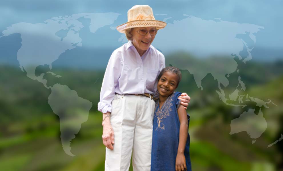 Rosalynn Carter hugs a young girl.